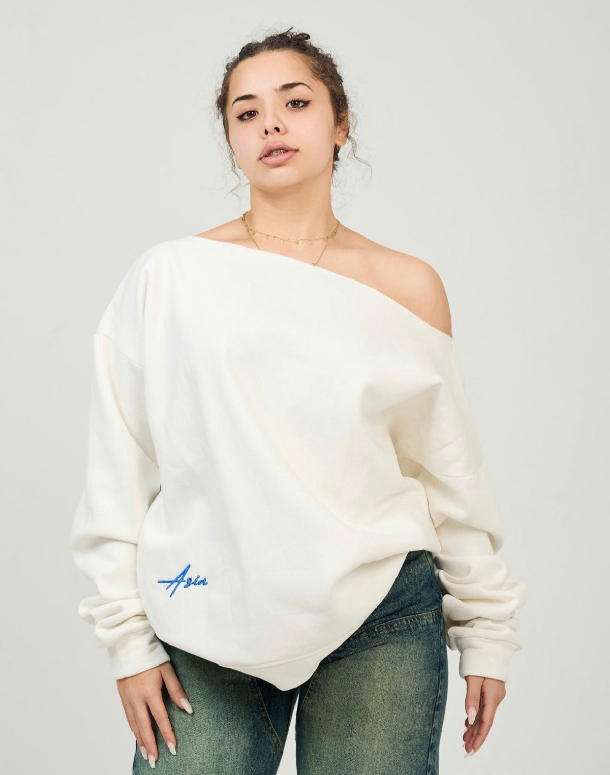 White off- shoulder sweater